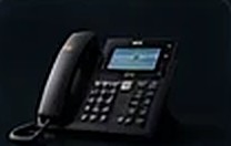 A business VoIP desk phone on a reception desk